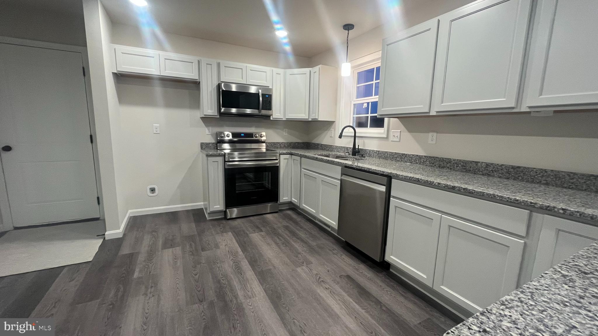 10030 Pendleton Avenue Waynesboro, PA 17268 - Photo 7 of 36 a kitchen with granite countertop a sink and steel appliances