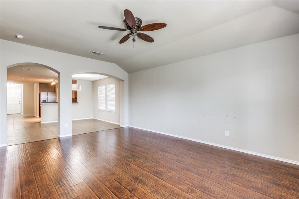 1101 Rainer Drive Princeton, TX 75407 - Photo 13 of 25 wooden floor in an empty room with a window