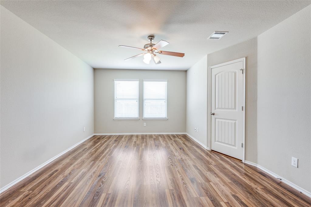 1101 Rainer Drive Princeton, TX 75407 - Photo 15 of 25 wooden floor in an empty room with a window