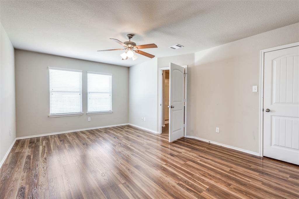 1101 Rainer Drive Princeton, TX 75407 - Photo 16 of 25 a view of empty room with wooden floor and fan