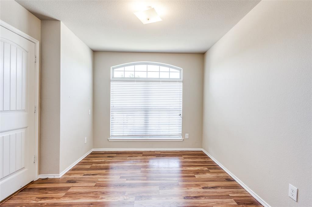 1101 Rainer Drive Princeton, TX 75407 - Photo 19 of 25 an empty room with wooden floor and windows