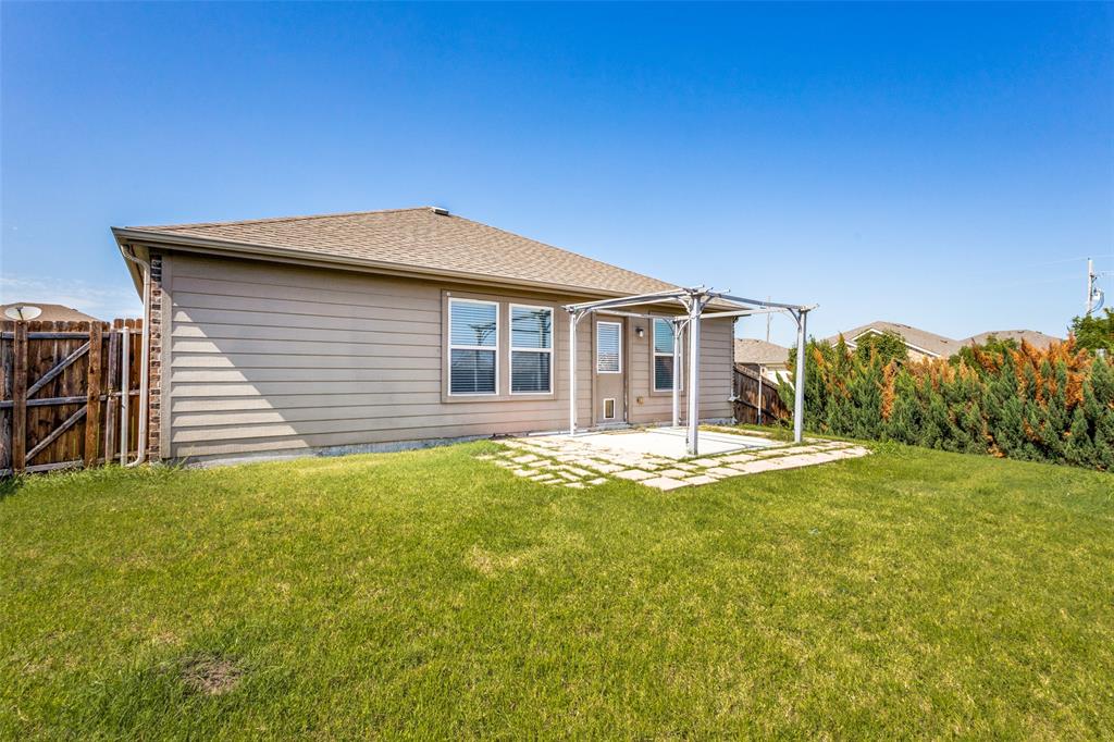 1101 Rainer Drive Princeton, TX 75407 - Photo 24 of 25 a front view of a house with a garden