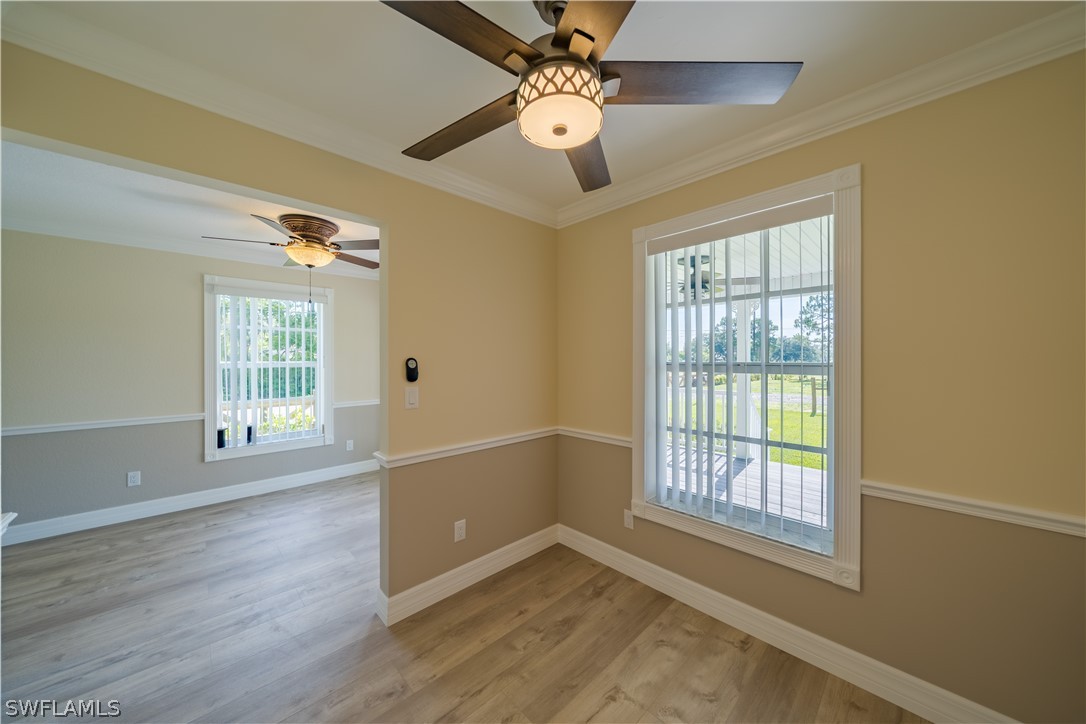 21510 North River Road Alva, FL 33920 - Photo 14 of 35 a view of an empty room with wooden floor and a window