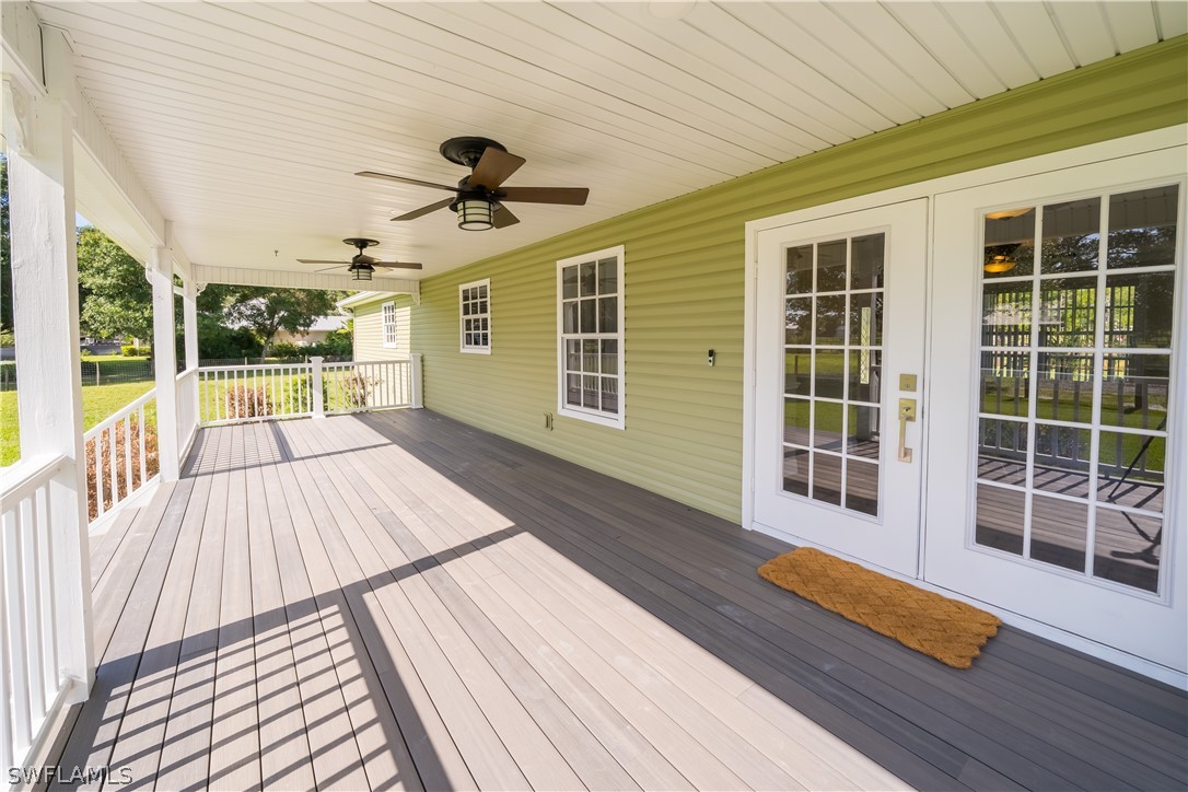 21510 North River Road Alva, FL 33920 - Photo 19 of 35 a view of a porch with wooden floor and iron stairs