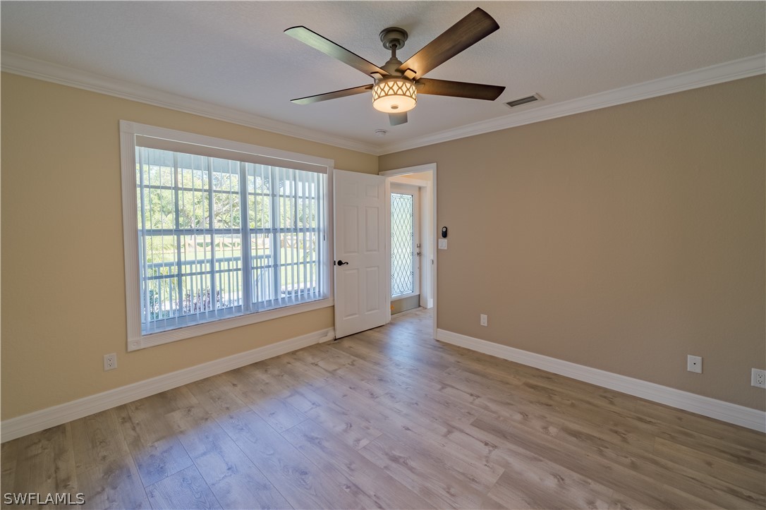 21510 North River Road Alva, FL 33920 - Photo 25 of 35 wooden floor in an empty room with a window