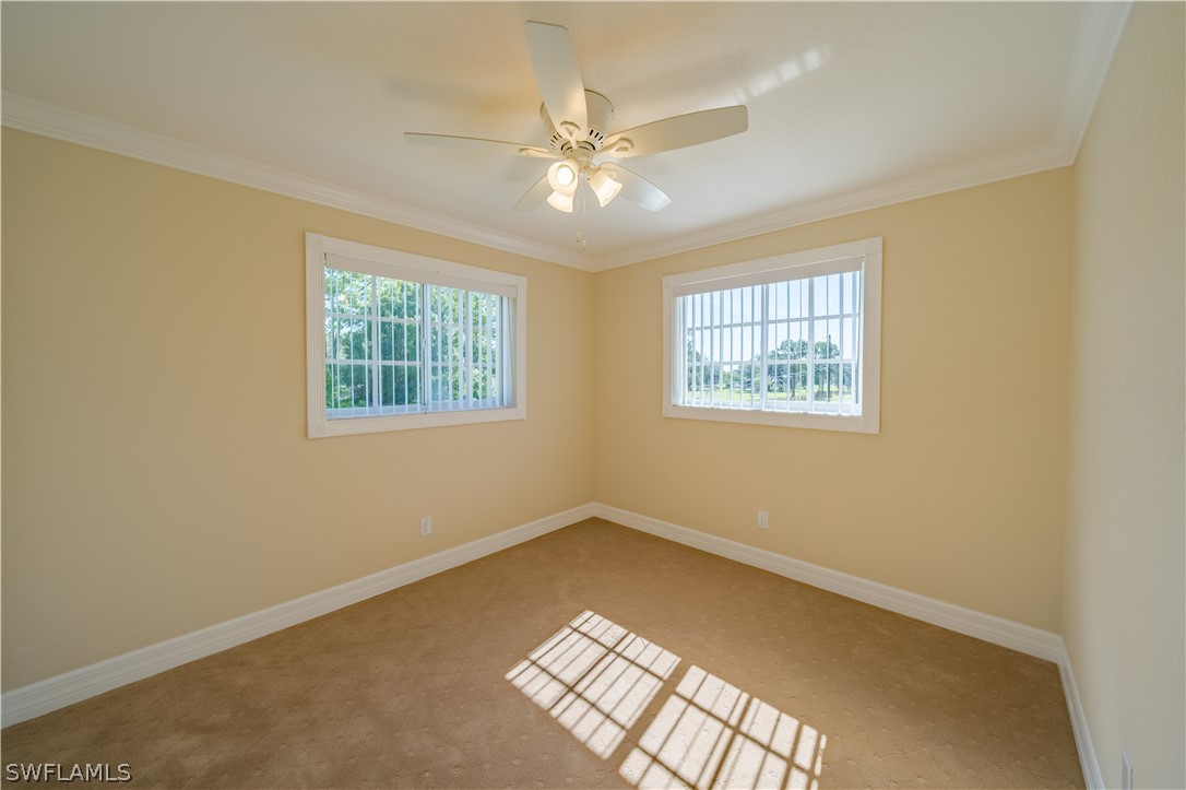21510 North River Road Alva, FL 33920 - Photo 28 of 35 an empty room with windows and fan