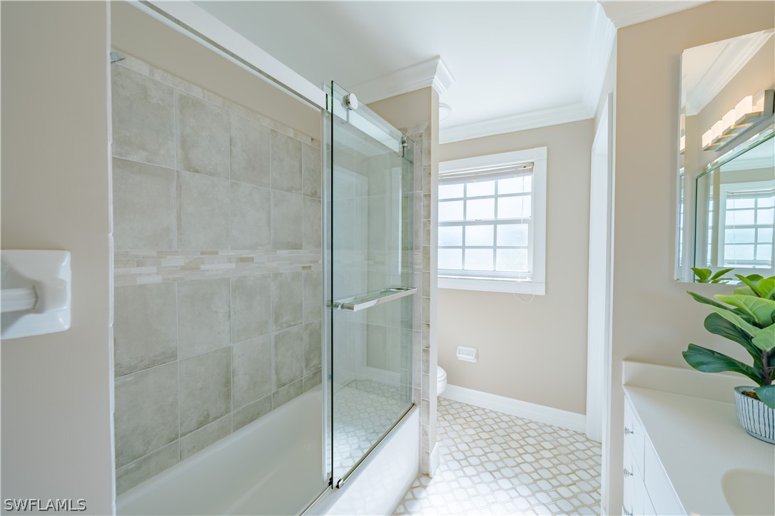 21510 North River Road Alva, FL 33920 - Photo 34 of 35 a bathroom with a shower and a bathtub