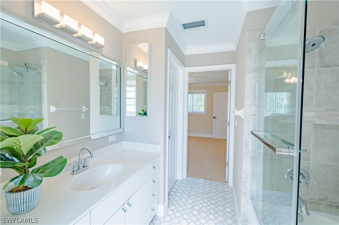 21510 North River Road Alva, FL 33920 - Photo 35 of 35 a bathroom with a granite countertop sink a mirror a bathtub and shower