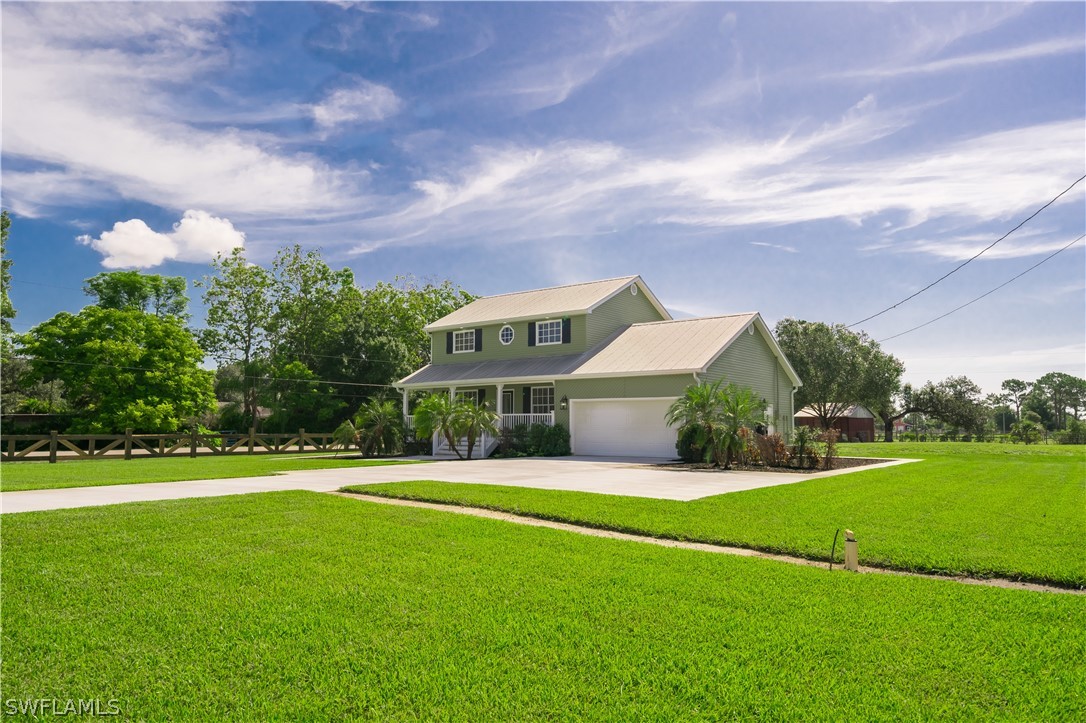 21510 North River Road Alva, FL 33920 - Photo 4 of 35 a front view of house with yard and green space