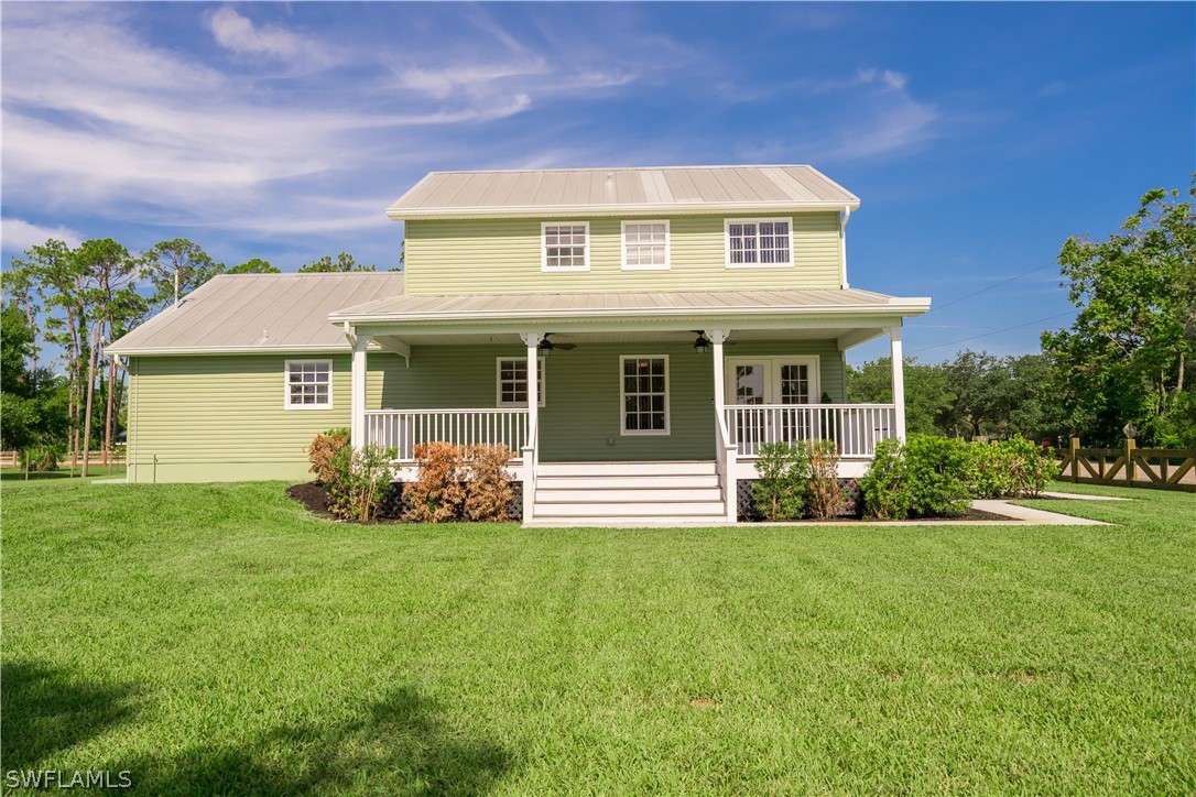 21510 North River Road Alva, FL 33920 - Photo 6 of 35 a front view of a house with a yard