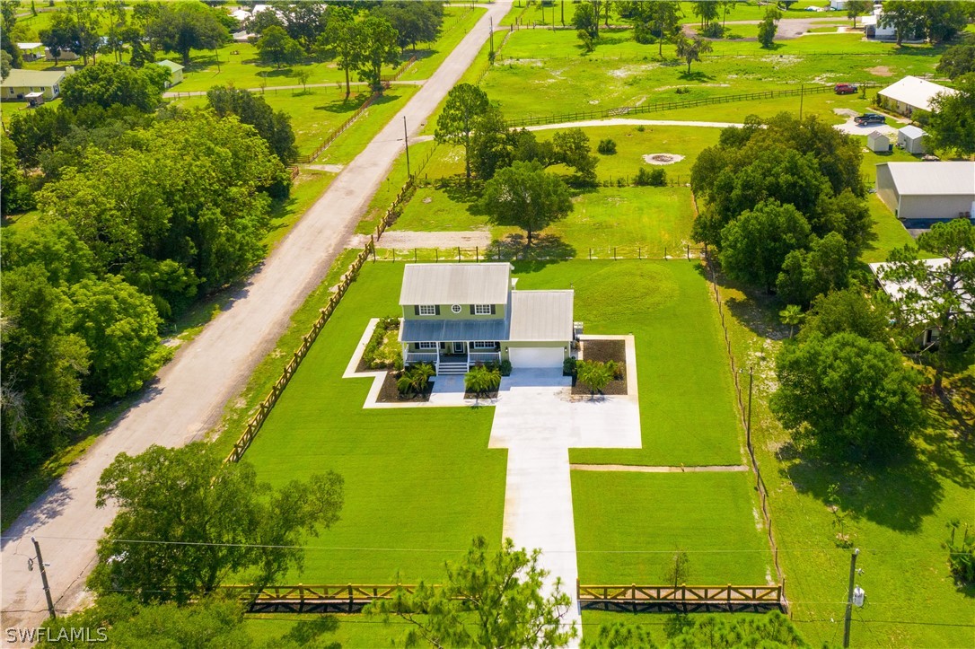 21510 North River Road Alva, FL 33920 - Photo 7 of 35 a view of an swimming pool with a yard