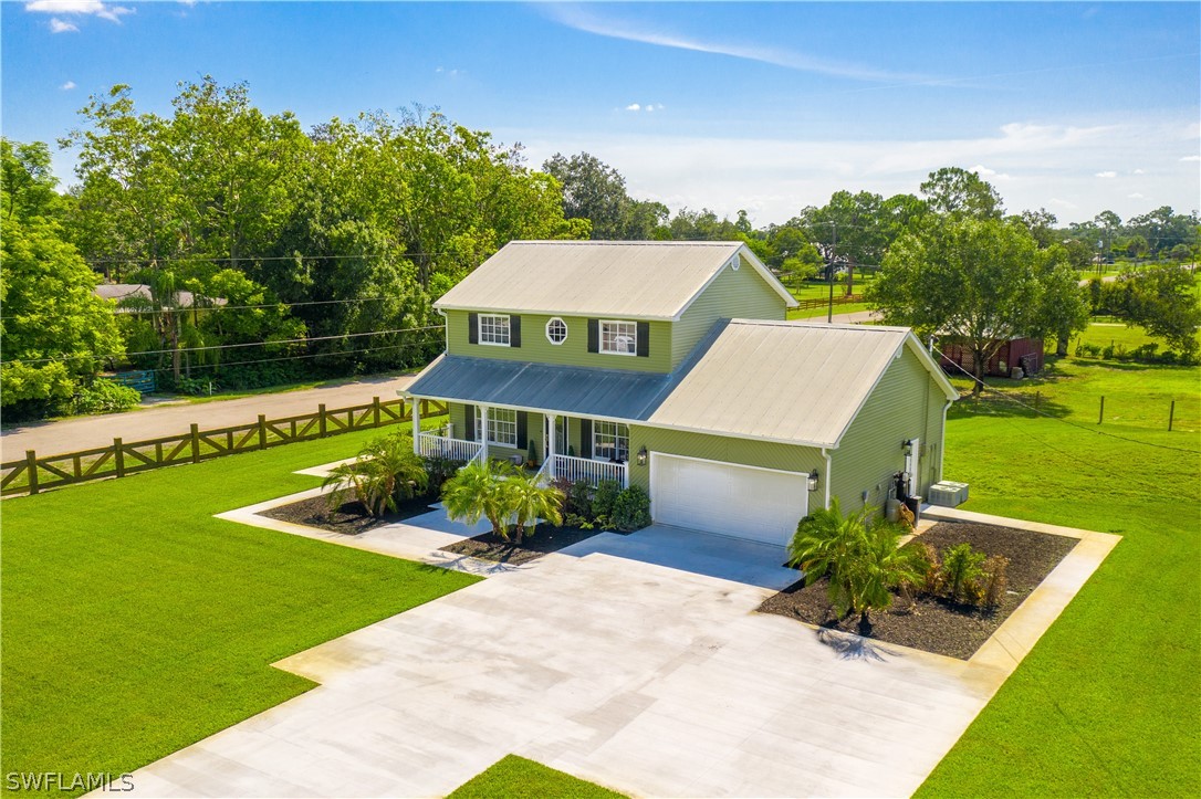 21510 North River Road Alva, FL 33920 - Photo 9 of 35 an aerial view of a house having yard