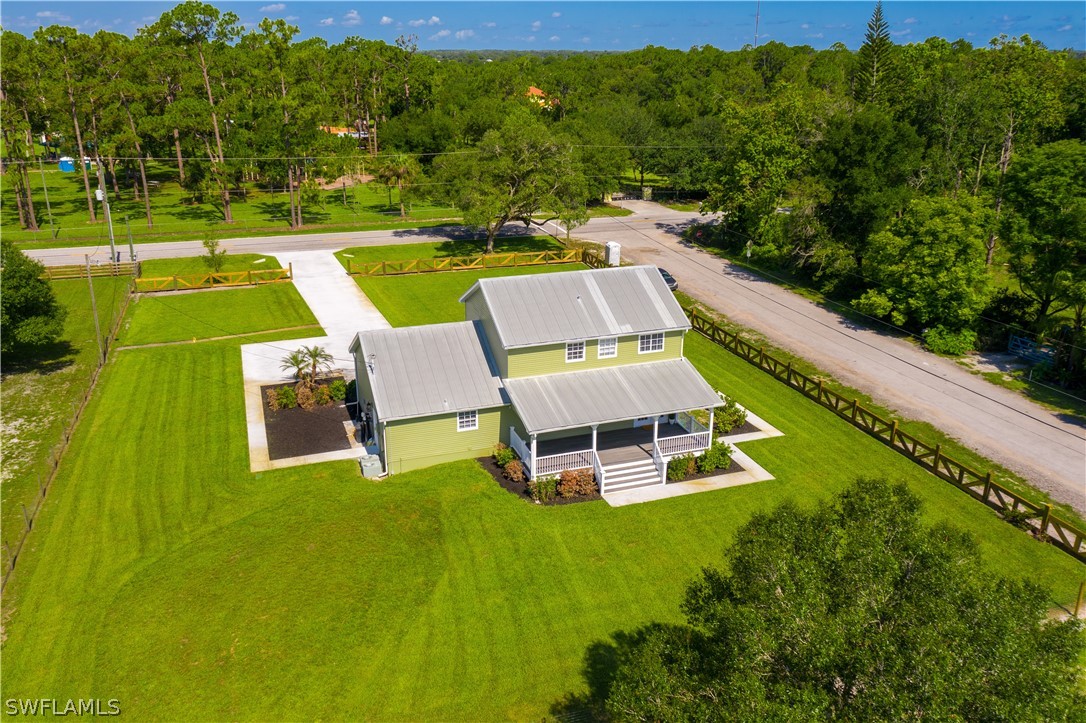21510 North River Road Alva, FL 33920 - Photo 10 of 35 an aerial view of a house with a swimming pool