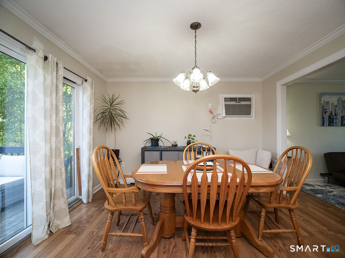 82 Wilcox Road Middletown, CT 06457 - Photo 15 of 27 a view of a dining room with furniture window and wooden floor