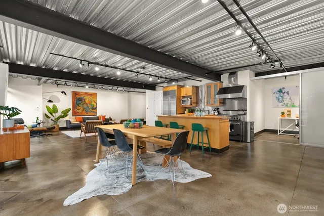 a view of a patio with table and chairs potted plants with wooden floor