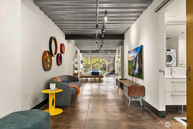 a living room with fireplace furniture and a window