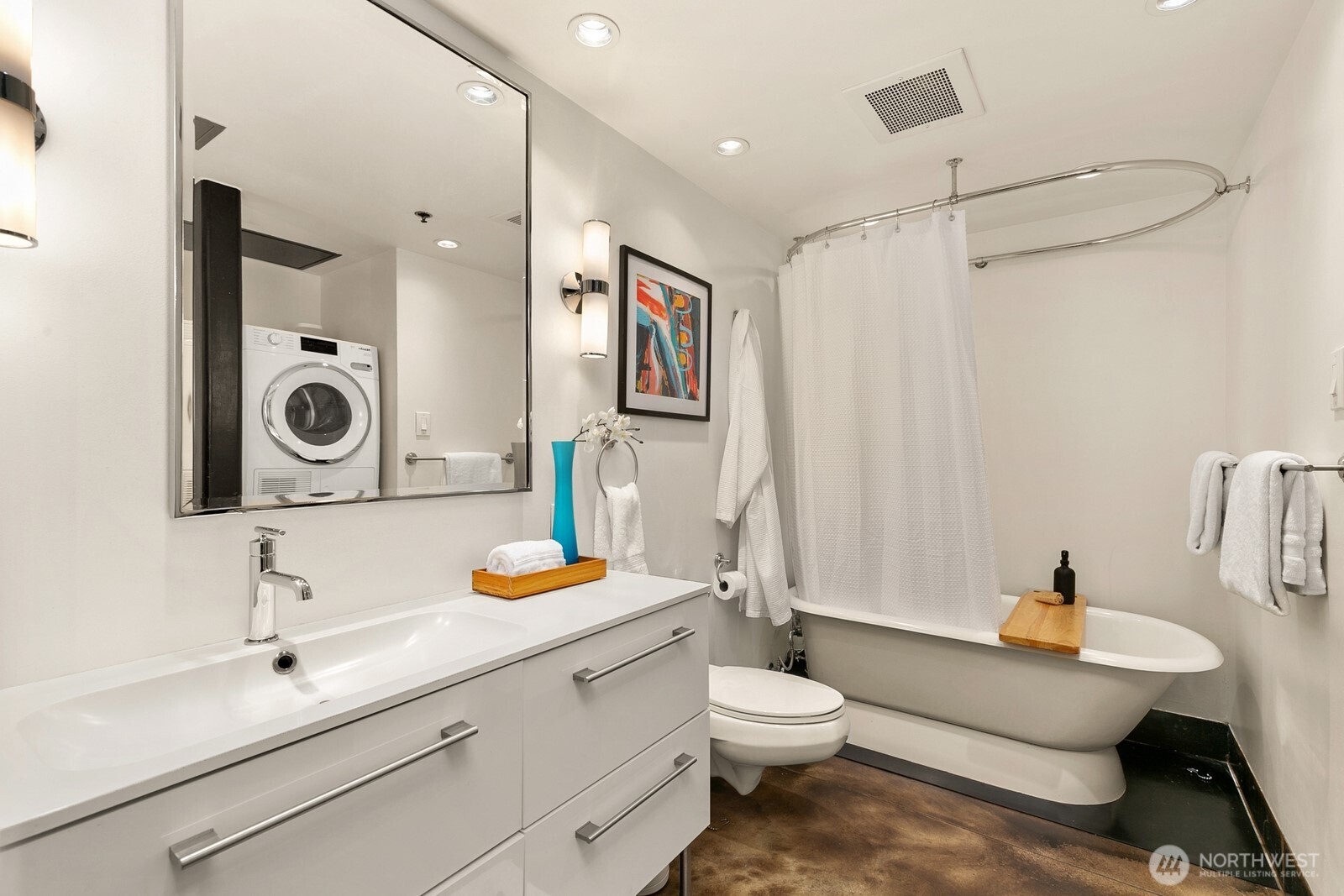 1310 East Union Street, Unit 202 Seattle, WA 98122 - Photo 20 of 31 a bathroom with a sink mirror vanity and toilet