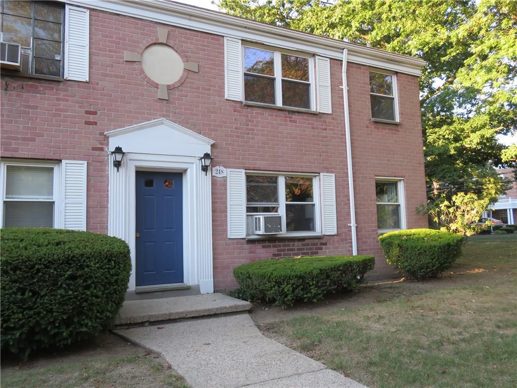 248 Seaton Road, Unit 4 Stamford, CT 06902 - Photo 1 of 1 a front view of a house with a yard