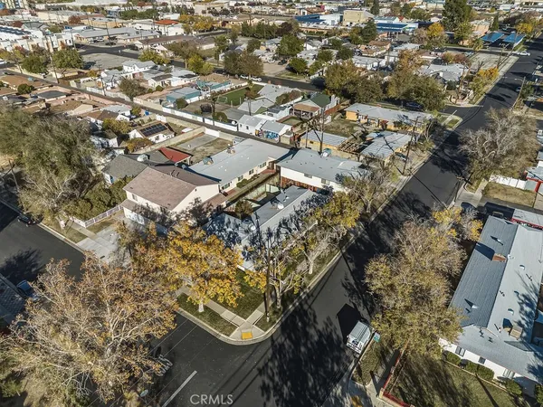 an aerial view of a residential houses with city view