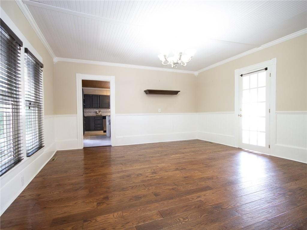 8076 Broad Street Rural Hall, NC 27045 - Photo 19 of 36 an empty room with wooden floor and windows