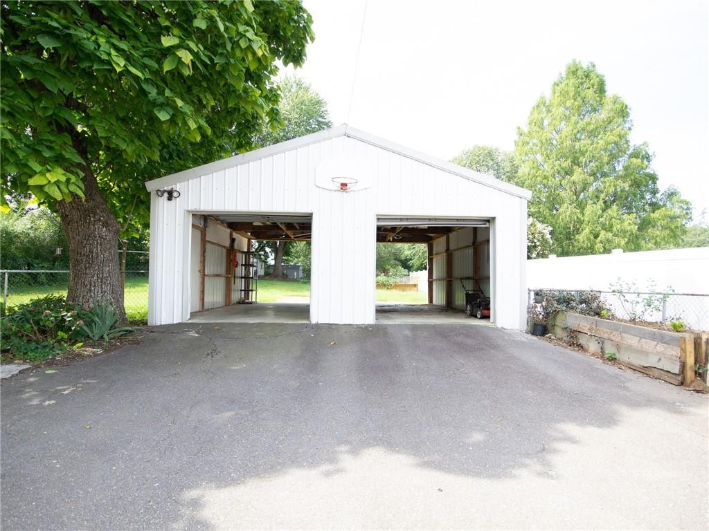 8076 Broad Street Rural Hall, NC 27045 - Photo 27 of 36 a view of a house with a yard and potted plants