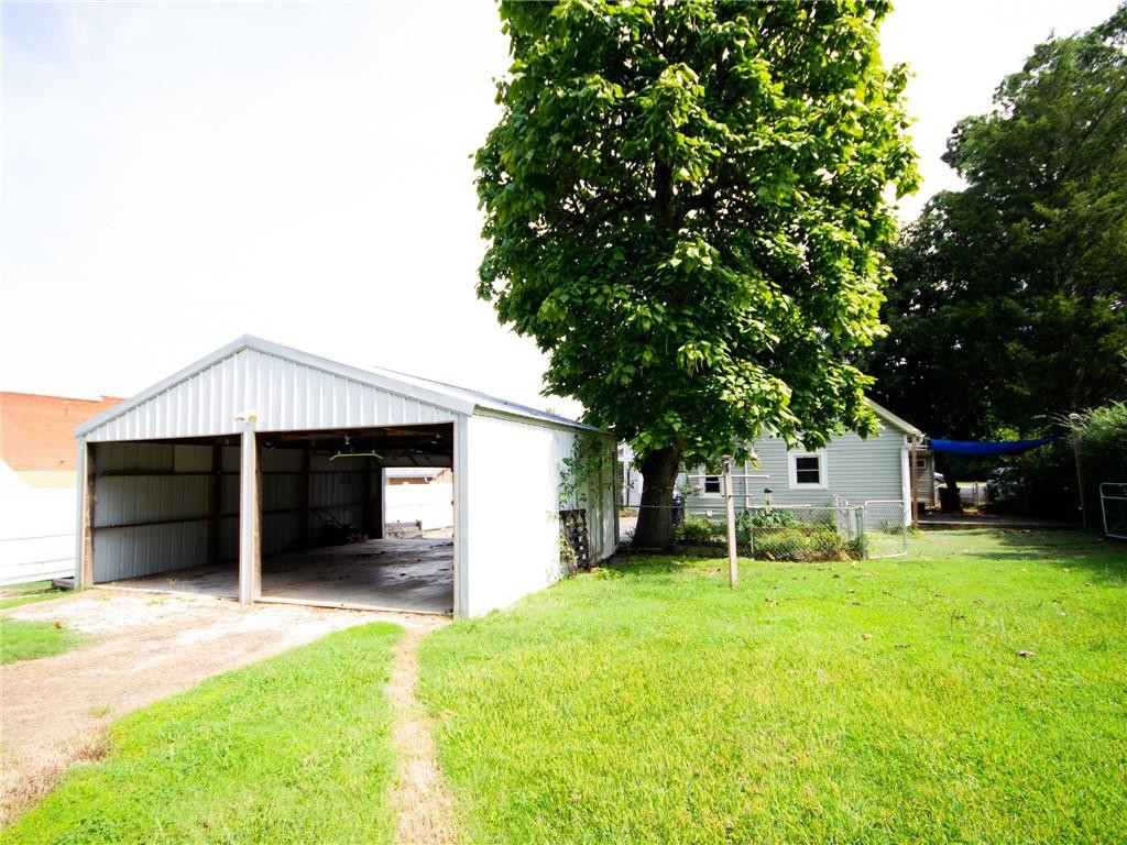 8076 Broad Street Rural Hall, NC 27045 - Photo 29 of 36 a view of a house with a yard and a large tree