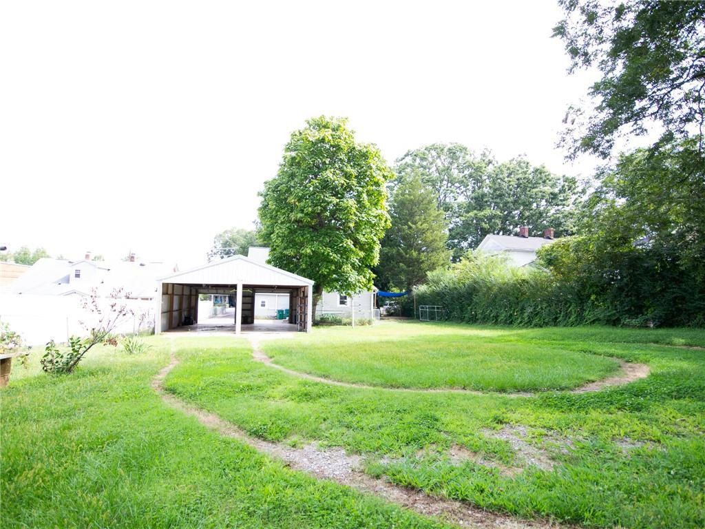 8076 Broad Street Rural Hall, NC 27045 - Photo 30 of 36 a house view with a garden space