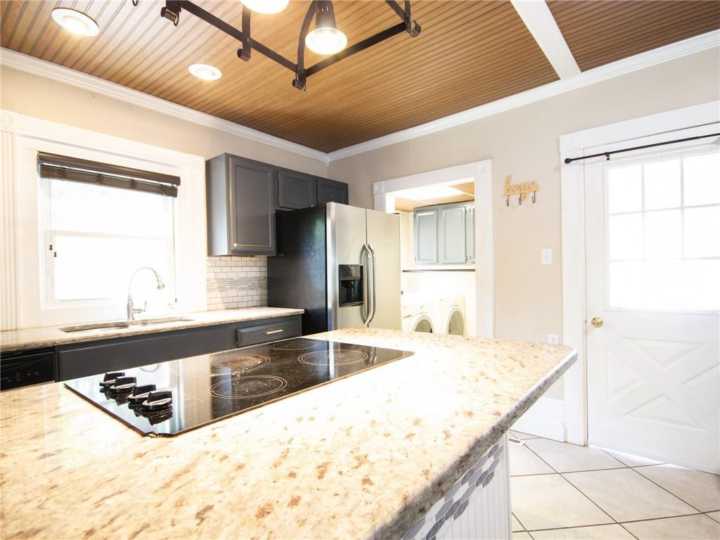 8076 Broad Street Rural Hall, NC 27045 - Photo 5 of 36 a large kitchen with granite countertop a sink and a refrigerator
