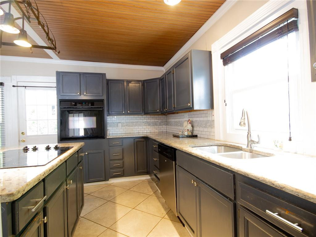 8076 Broad Street Rural Hall, NC 27045 - Photo 6 of 36 a kitchen with stainless steel appliances granite countertop a sink stove and cabinets