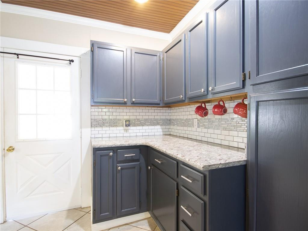 8076 Broad Street Rural Hall, NC 27045 - Photo 7 of 36 a utility room with granite countertop cabinets and sink