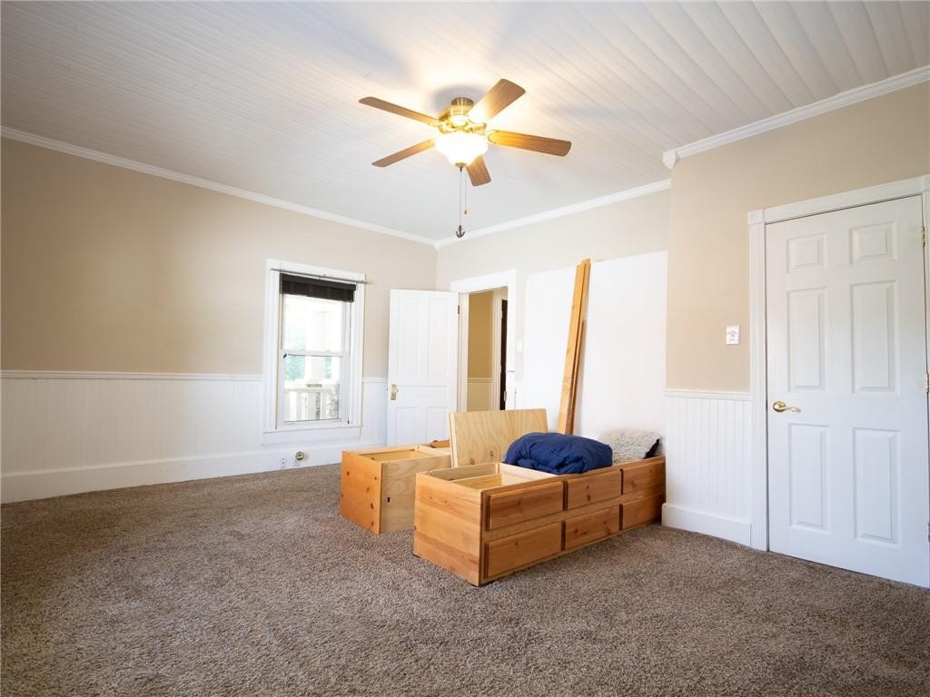 8076 Broad Street Rural Hall, NC 27045 - Photo 9 of 36 a living room with furniture and a chandelier