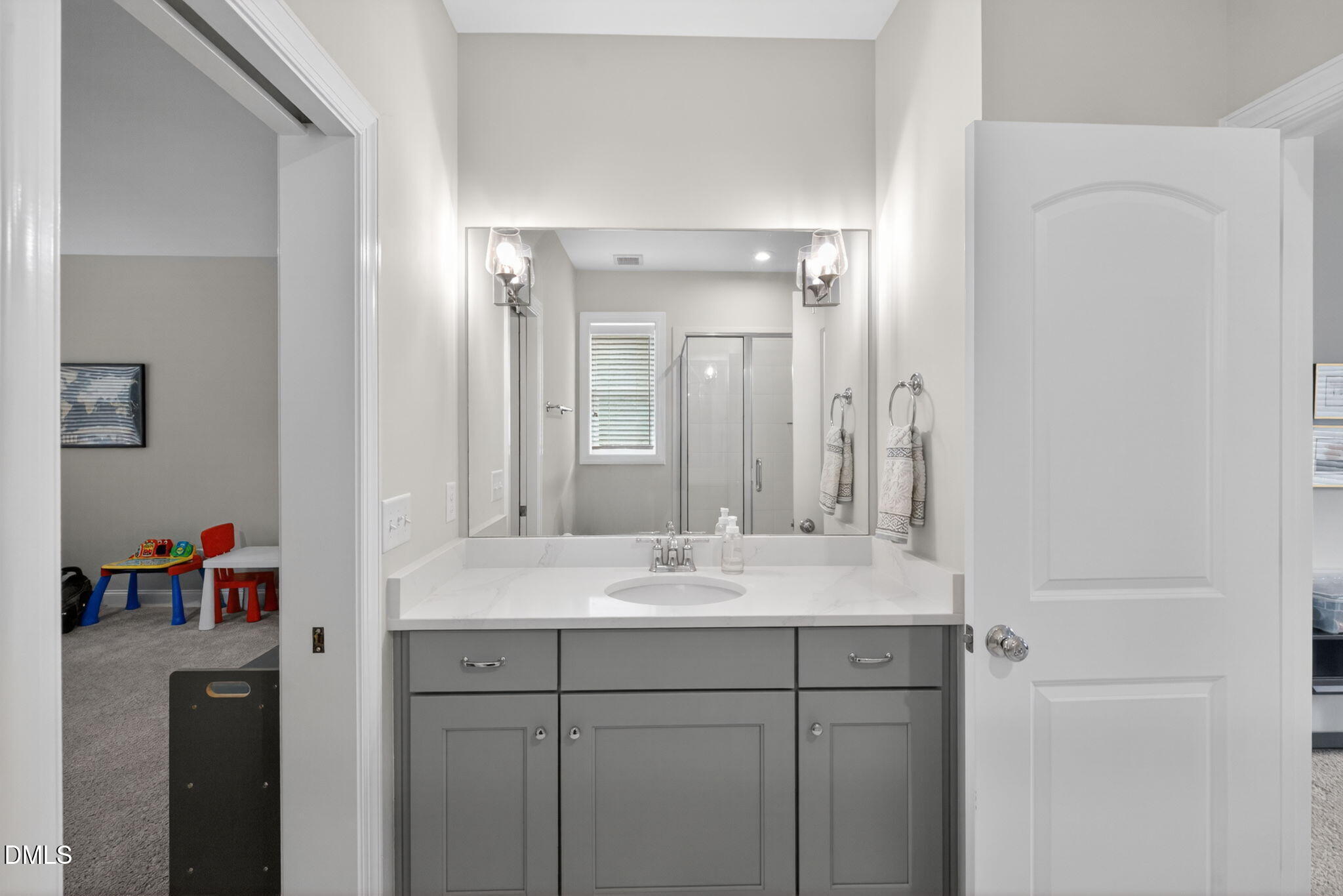 6901 Ray Family Farm Court Raleigh, NC 27613 - Photo 31 of 52 a bathroom with a sink vanity and mirror