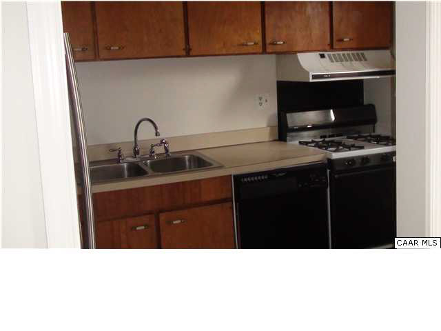 2517 Hydraulic Road, Unit 85 Charlottesville, VA 22901 - Photo 6 of 6 a kitchen with a sink a stove and cabinets
