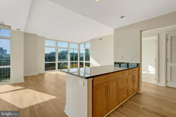 a kitchen with stainless steel appliances granite countertop a sink and a granite counter tops