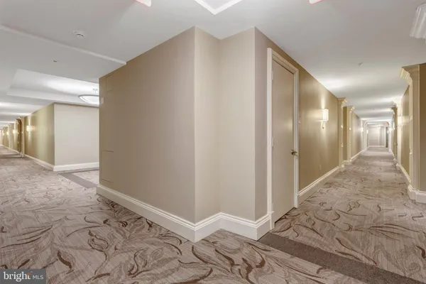 a view of room with wooden floor