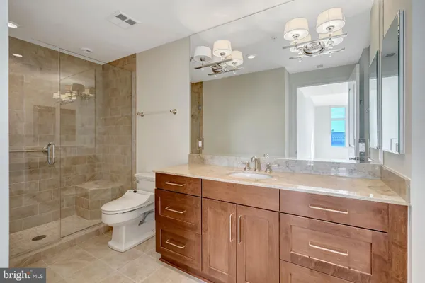 a view of an empty room and wooden floor