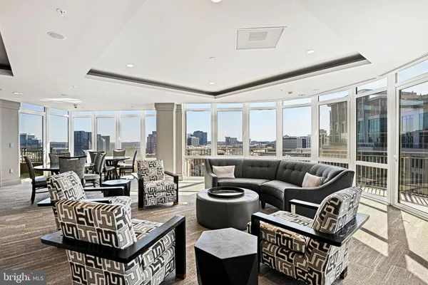 a view of a patio with a table chairs and backyard