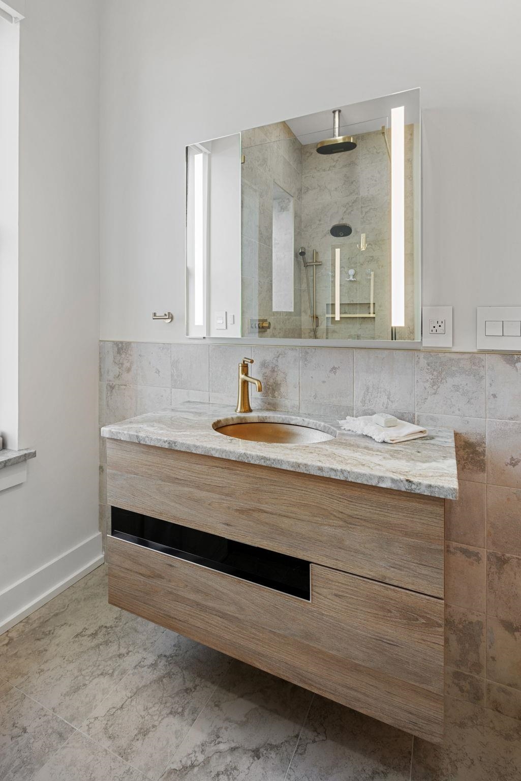 277 York Street, Unit 501 Jersey City, NJ 07302 - Photo 14 of 18 a bathroom with a sink and a mirror