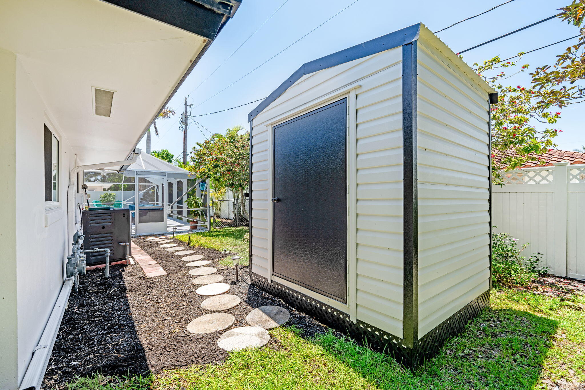 1081 Bimini Lane Singer Island, FL 33404 - Photo 37 of 39 shed in rear of home for ample storage