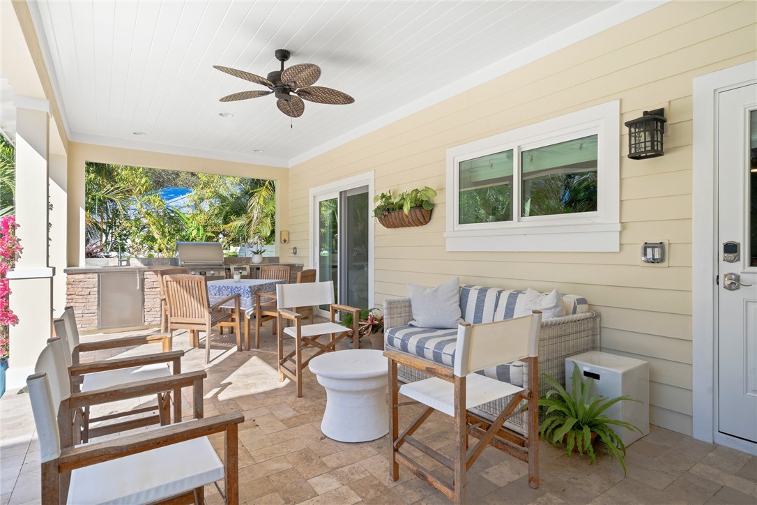 548 Conn Way Vero Beach, FL 32963 - Photo 13 of 34 a living room with patio furniture and a large window