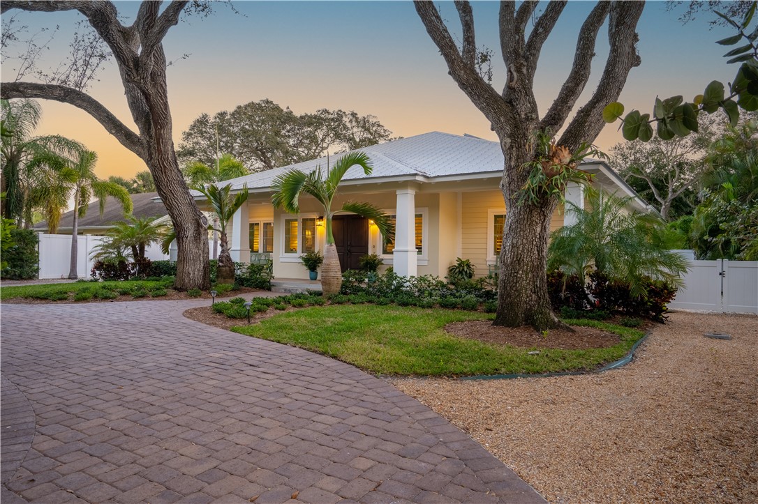 548 Conn Way Vero Beach, FL 32963 - Photo 2 of 34 a front view of a house with garden
