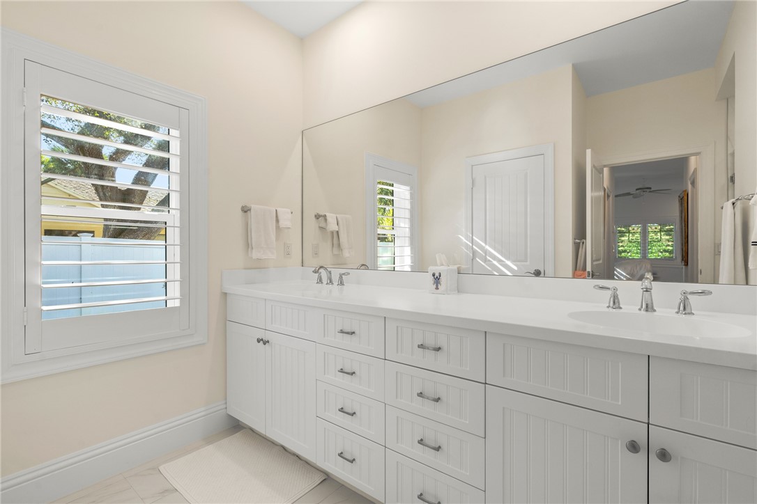 548 Conn Way Vero Beach, FL 32963 - Photo 25 of 34 a bathroom with double sink and a window