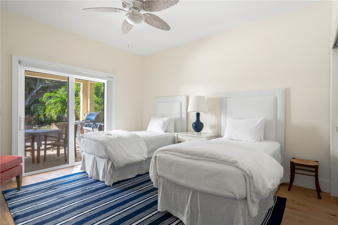 548 Conn Way Vero Beach, FL 32963 - Photo 27 of 34 a bedroom with two beds and a large window