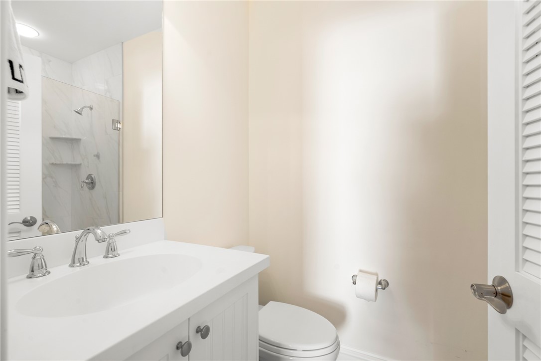 548 Conn Way Vero Beach, FL 32963 - Photo 31 of 34 a bathroom with a sink a toilet and shower