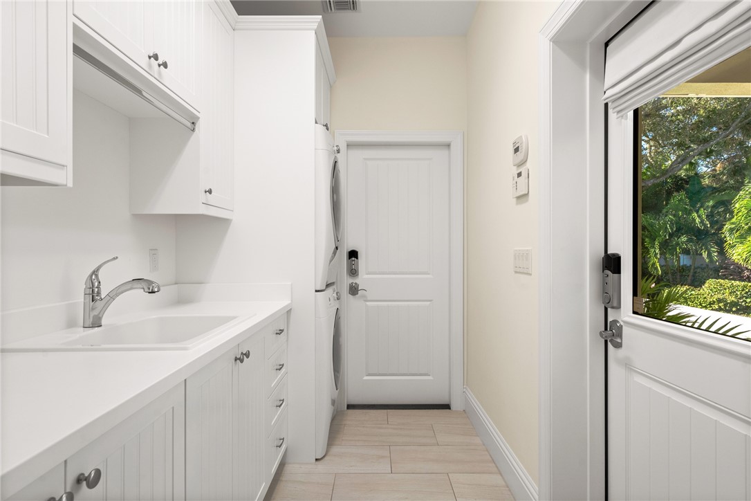 548 Conn Way Vero Beach, FL 32963 - Photo 32 of 34 a bathroom with a sink and a mirror