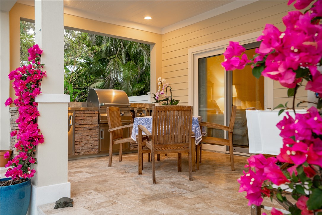 548 Conn Way Vero Beach, FL 32963 - Photo 6 of 34 a view of a dining room with furniture and potted plants