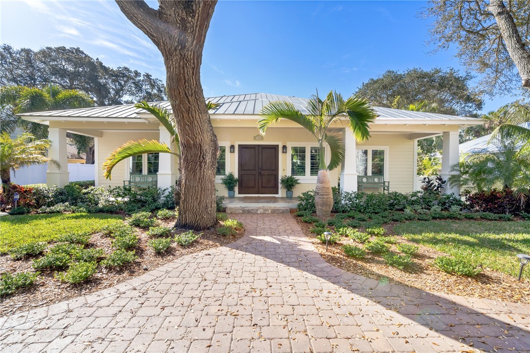 548 Conn Way Vero Beach, FL 32963 - Photo 8 of 34 a front view of a house with garden