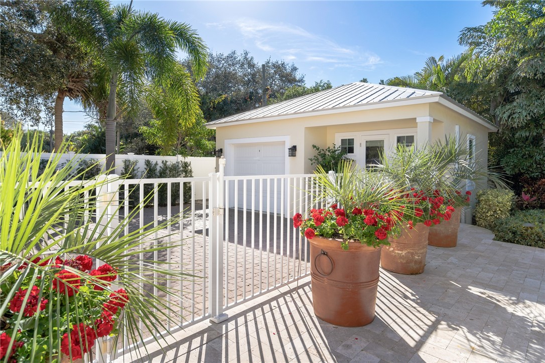 548 Conn Way Vero Beach, FL 32963 - Photo 9 of 34 a view of a house with a flower garden