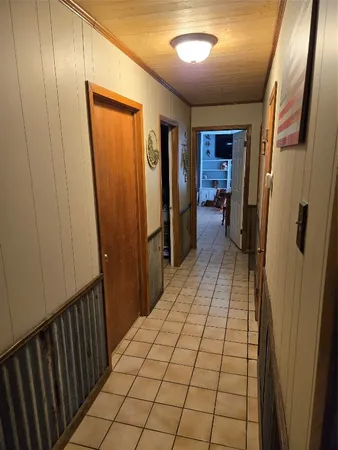 a view of hallway with a mirror