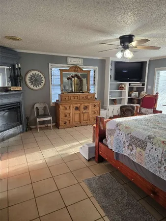 a bedroom with a large bed and a tv